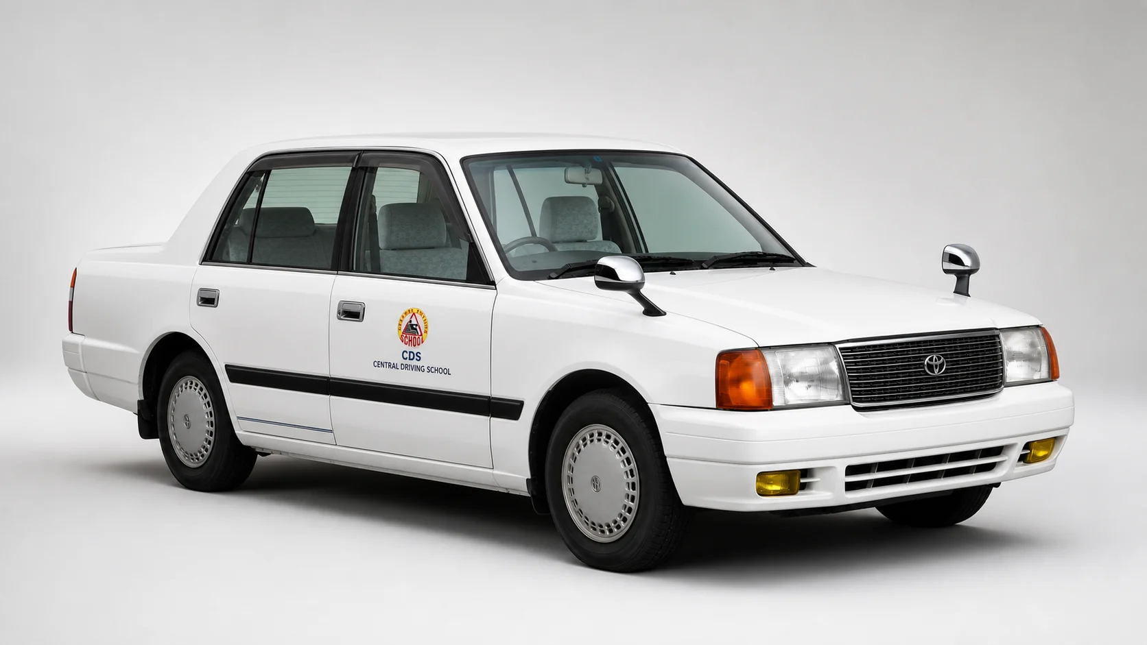 White Toyota Comfort with subtle CDS door branding for Class B practical training